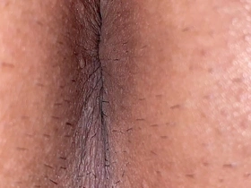 A close-up view of the man's asshole down to every wrinkle