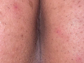 A man exposes his asshole. Take a close-up shot so you can see the wrinkles clearly