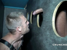 A gay is sucking XXL blakc cock in gloryholes